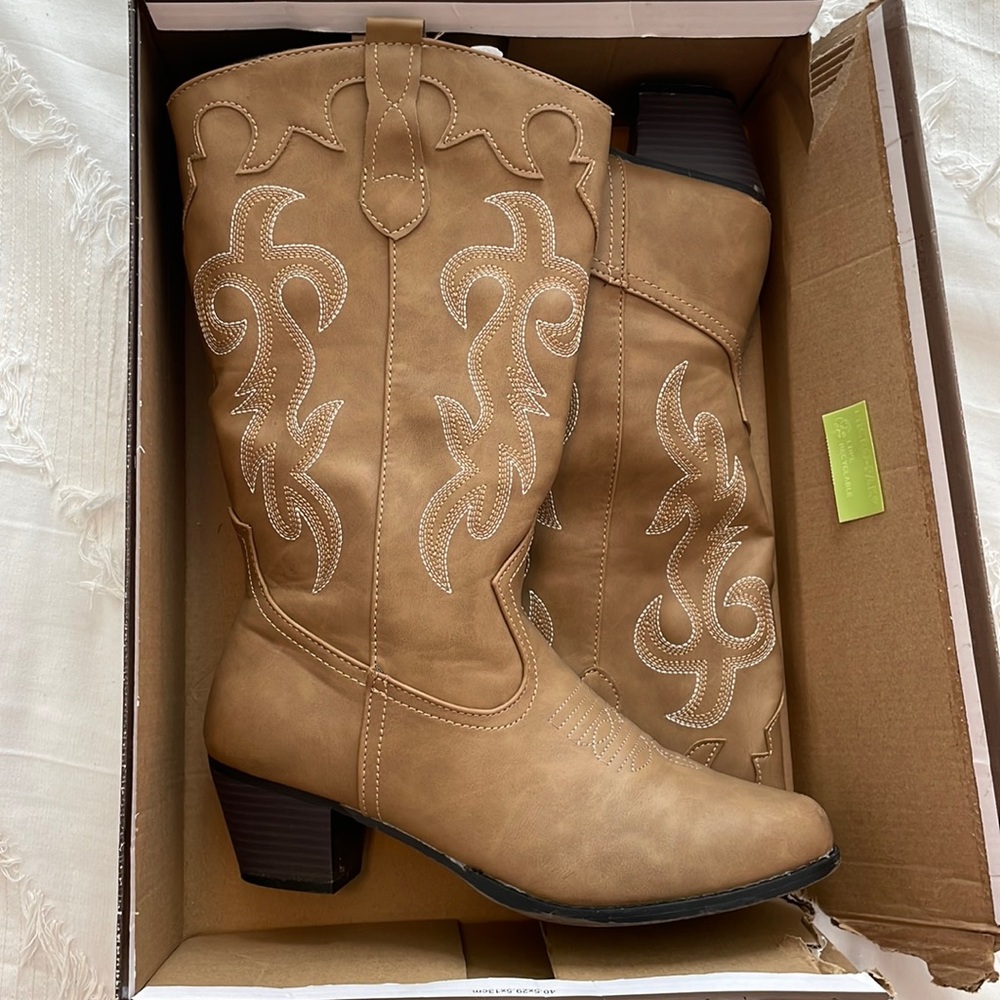 Super cute brown cowboy boots. Worn one time!